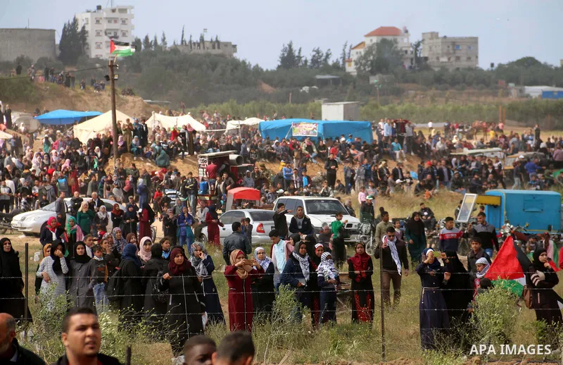 Palestinian protesters clash with Israeli security forces in a tent city protest at along the Israel border with Gaza, demanding the right to return to their homeland, in al-Bureij in the center of Gaza strip on March 30...