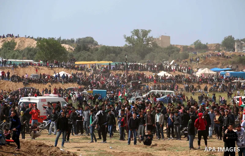 Palestinian protesters clash with Israeli security forces in a tent city protest at along the Israel border with Gaza, demanding the right to return to their homeland, in al-Bureij in the center of Gaza strip on March 30...