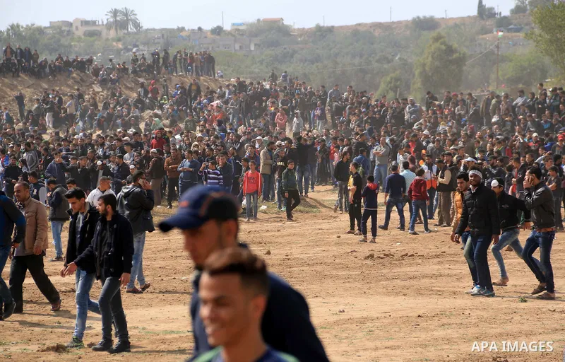 Palestinian protesters clash with Israeli security forces in a tent city protest at along the Israel border with Gaza, demanding the right to return to their homeland, in al-Bureij in the center of Gaza strip on March 30...