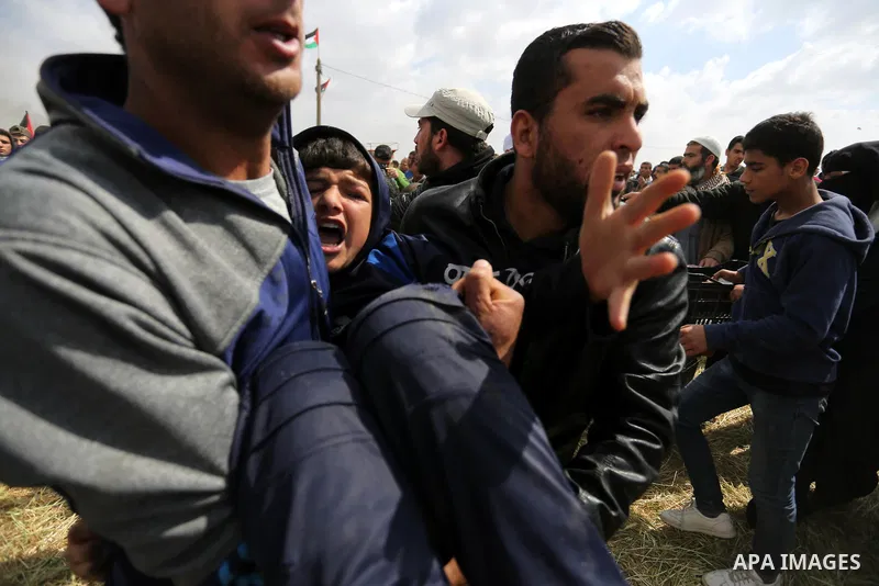A wounded Palestinian is evacuated during clashes with Israeli security forces during a tent city protest along the Israel border with Gaza, demanding the right to return to their homeland, in Khan Younis in the southern...