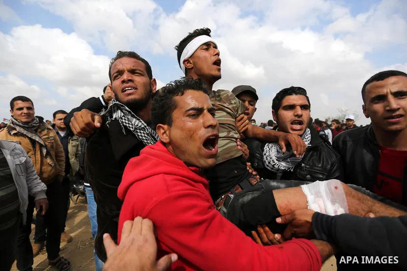 A wounded Palestinian is evacuated during clashes with Israeli security forces during a tent city protest along the Israel border with Gaza, demanding the right to return to their homeland, in Khan Younis in the southern...
