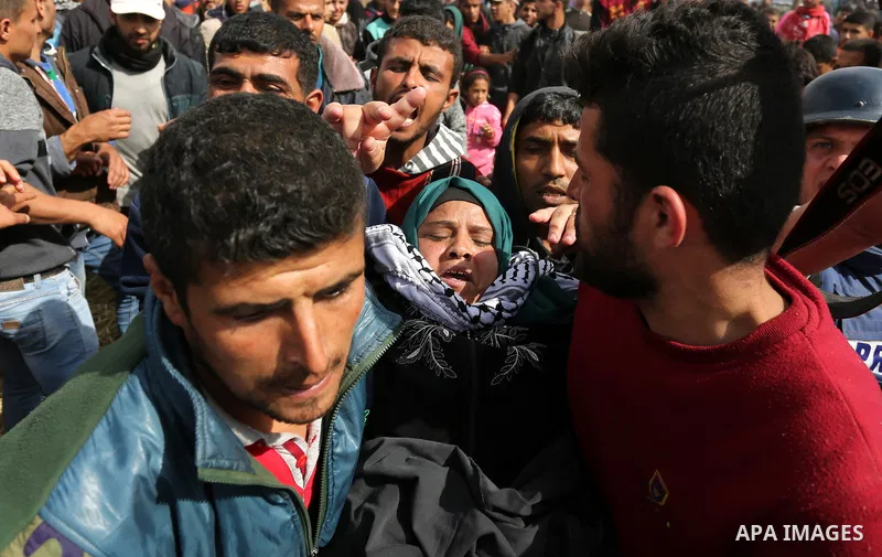 A wounded Palestinian woman is evacuated during clashes with Israeli security forces during a tent city protest along the Israel border with Gaza, demanding the right to return to their homeland, in Khan Younis in the so...
