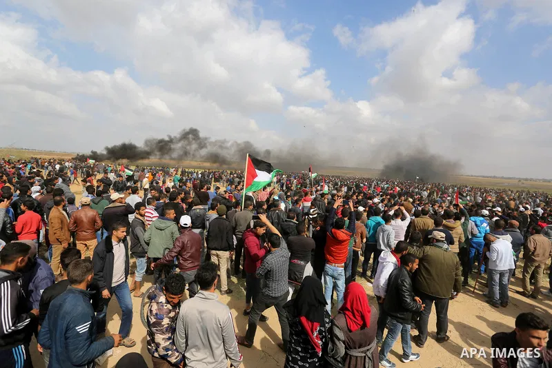 Palestinians take part during a tent city protest along the Israel border with Gaza, demanding the right to return to their homeland, in Khan Younis in the southern Gaza Strip March 30, 2018. Photo by Ashraf Amra