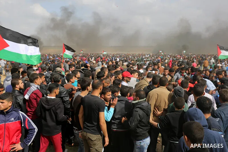 Palestinians take part during a tent city protest along the Israel border with Gaza, demanding the right to return to their homeland, in Khan Younis in the southern Gaza Strip March 30, 2018. Photo by Ashraf Amra