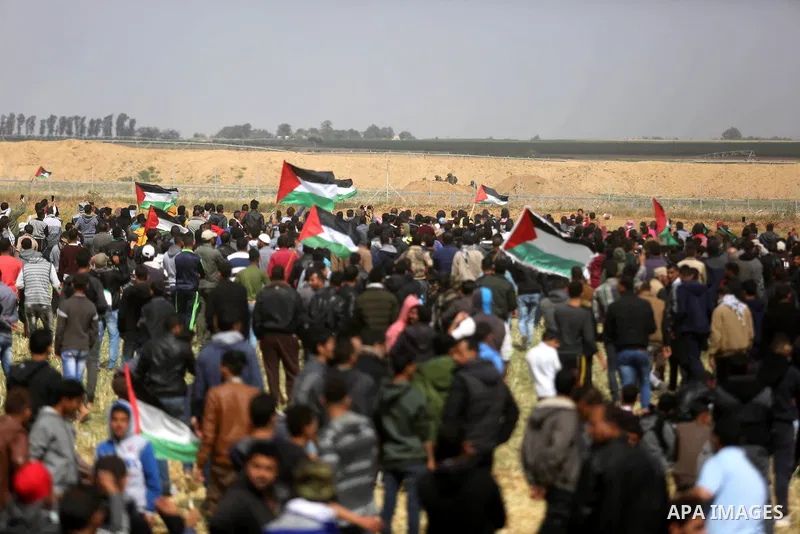 Palestinians take part during a tent city protest along the Israel border with Gaza, demanding the right to return to their homeland, in Khan Younis in the southern Gaza Strip March 30, 2018. Photo by Ashraf Amra