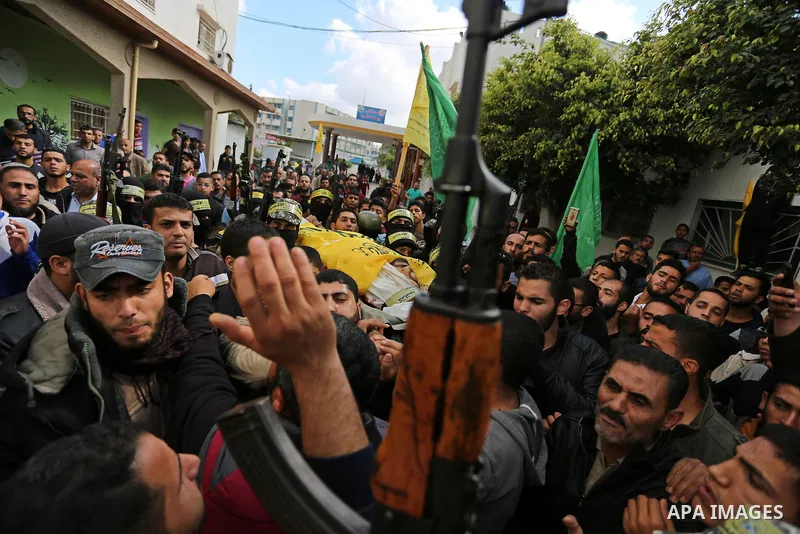 Palestinians carry the body of Hamdan Abu Amsha who was killed a day earlier during clashes with Israeli security forces in a tent city protest along the Israel border with Gaza, demanding the right to return to their ho...