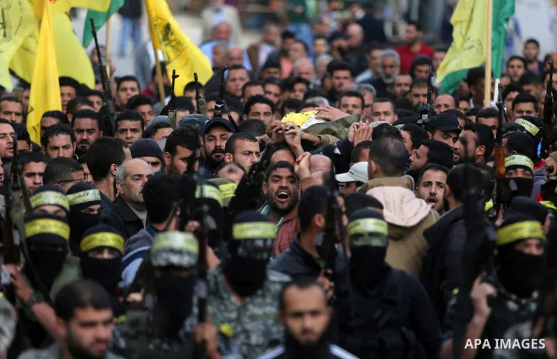 Palestinians carry the body of Hamdan Abu Amsha who was killed a day earlier during clashes with Israeli security forces in a tent city protest along the Israel border with Gaza, demanding the right to return to their ho...