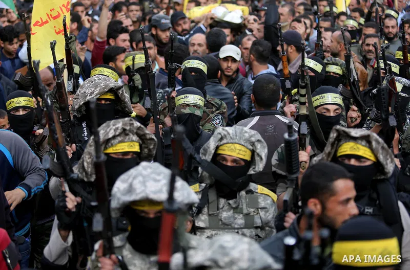 Palestinians carry the body of Hamdan Abu Amsha who was killed a day earlier during clashes with Israeli security forces in a tent city protest along the Israel border with Gaza, demanding the right to return to their ho...