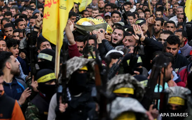 Palestinians carry the body of Hamdan Abu Amsha who was killed a day earlier during clashes with Israeli security forces in a tent city protest along the Israel border with Gaza, demanding the right to return to their ho...