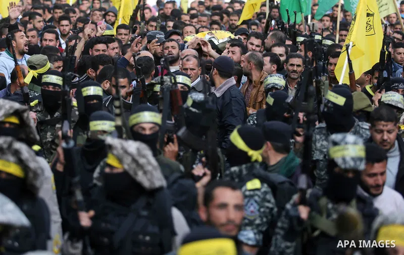 Palestinians carry the body of Hamdan Abu Amsha who was killed a day earlier during clashes with Israeli security forces in a tent city protest along the Israel border with Gaza, demanding the right to return to their ho...