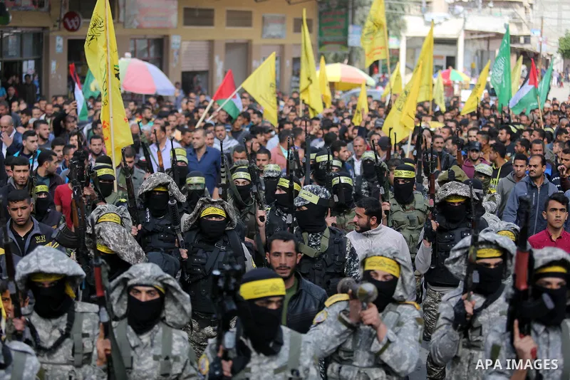 Palestinians carry the body of Hamdan Abu Amsha who was killed a day earlier during clashes with Israeli security forces in a tent city protest along the Israel border with Gaza, demanding the right to return to their ho...