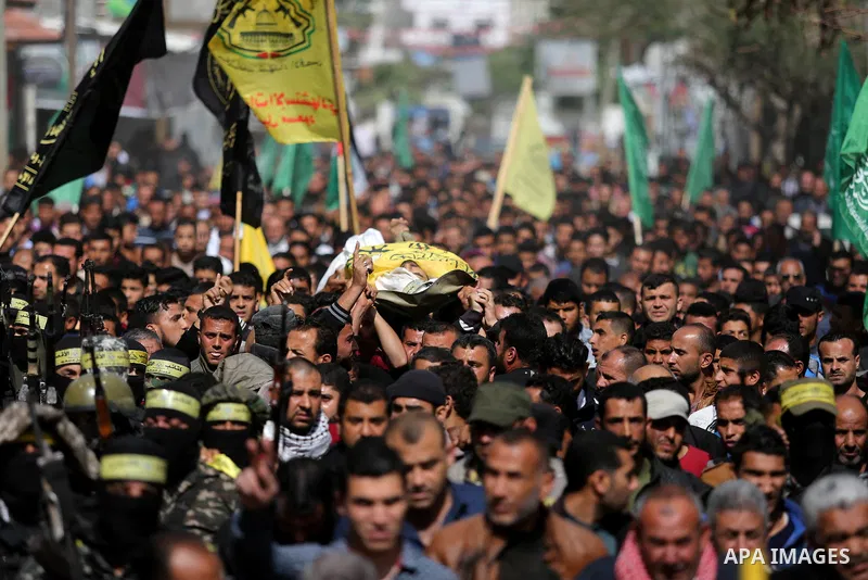 Palestinians carry the body of Hamdan Abu Amsha who was killed a day earlier during clashes with Israeli security forces in a tent city protest along the Israel border with Gaza, demanding the right to return to their ho...