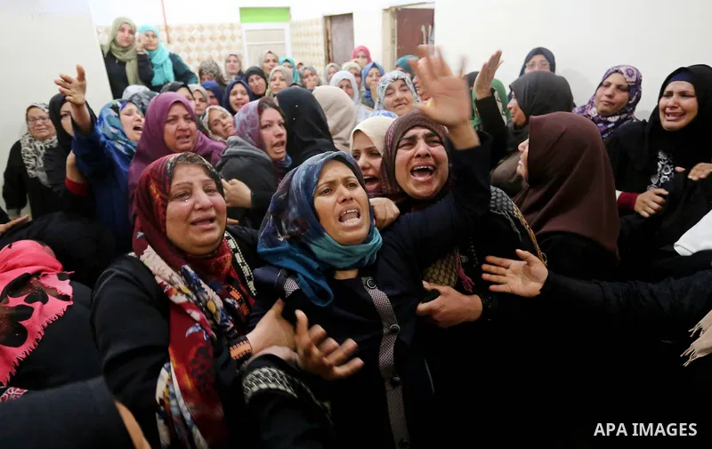 Relatives of Palestinian Hamdan Abu Amshah who was killed a day earlier during clashes with Israeli security forces in a tent city protest along the Israel border with Gaza, demanding the right to return to their homelan...