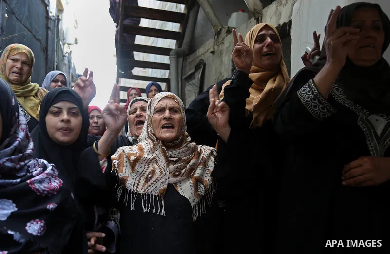 Relatives of Palestinian Hamdan Abu Amshah who was killed a day earlier during clashes with Israeli security forces in a tent city protest along the Israel border with Gaza, demanding the right to return to their homelan...