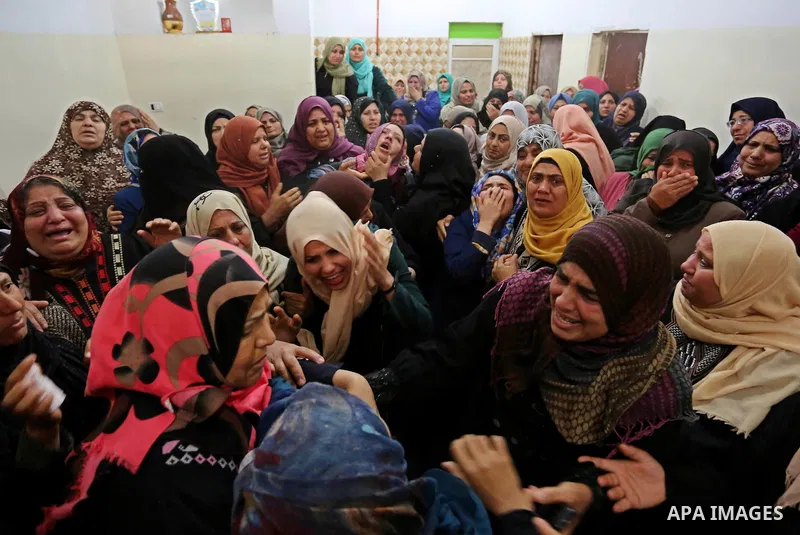 Relatives of Palestinian Hamdan Abu Amshah who was killed a day earlier during clashes with Israeli security forces in a tent city protest along the Israel border with Gaza, demanding the right to return to their homelan...