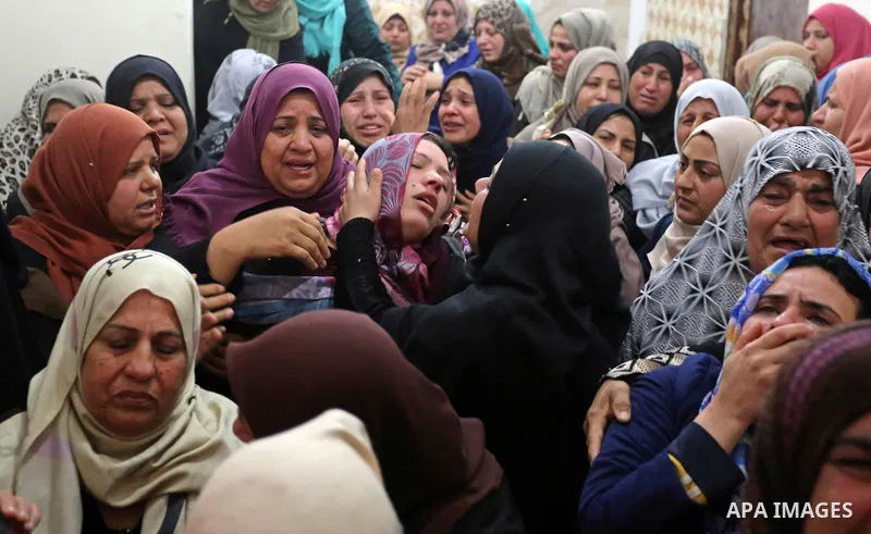 Relatives of Palestinian Hamdan Abu Amshah who was killed a day earlier during clashes with Israeli security forces in a tent city protest along the Israel border with Gaza, demanding the right to return to their homelan...