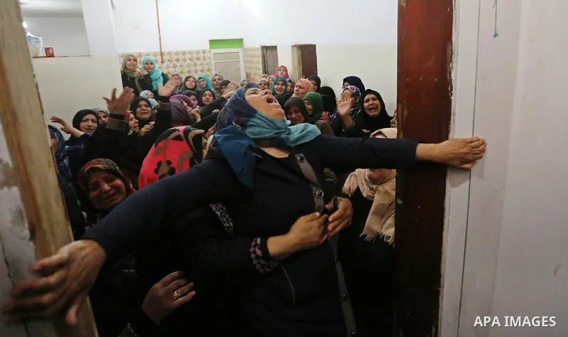 Relatives of Palestinian Hamdan Abu Amshah who was killed a day earlier during clashes with Israeli security forces in a tent city protest along the Israel border with Gaza, demanding the right to return to their homelan...