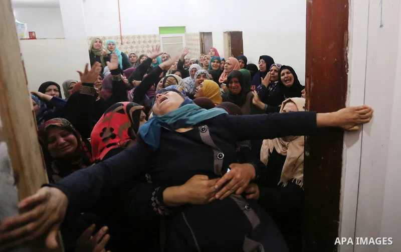 Relatives of Palestinian Hamdan Abu Amshah who was killed a day earlier during clashes with Israeli security forces in a tent city protest along the Israel border with Gaza, demanding the right to return to their homelan...