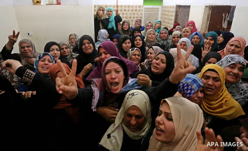 Relatives of Palestinian Hamdan Abu Amshah who was killed a day earlier during clashes with Israeli security forces in a tent city protest along the Israel border with Gaza, demanding the right to return to their homelan...