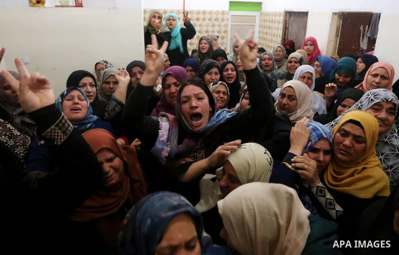 Relatives of Palestinian Hamdan Abu Amshah who was killed a day earlier during clashes with Israeli security forces in a tent city protest along the Israel border with Gaza, demanding the right to return to their homelan...