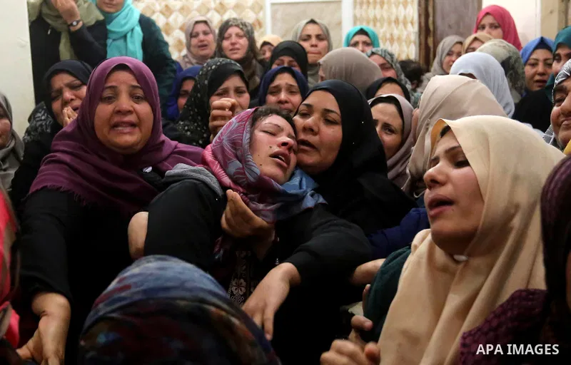 Relatives of Palestinian Hamdan Abu Amshah who was killed a day earlier during clashes with Israeli security forces in a tent city protest along the Israel border with Gaza, demanding the right to return to their homelan...