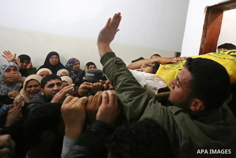 Relatives of Palestinian Hamdan Abu Amshah who was killed a day earlier during clashes with Israeli security forces in a tent city protest along the Israel border with Gaza, demanding the right to return to their homelan...