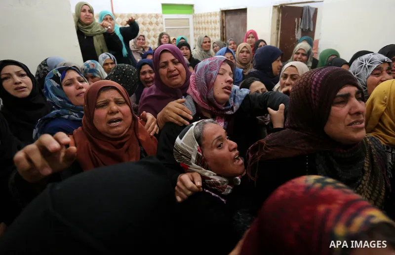 Relatives of Palestinian Hamdan Abu Amshah who was killed a day earlier during clashes with Israeli security forces in a tent city protest along the Israel border with Gaza, demanding the right to return to their homelan...