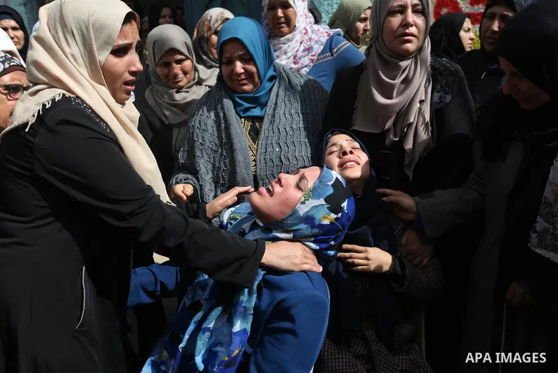 Relatives of Palestinian Hamdan Abu Amshah who was killed a day earlier during clashes with Israeli security forces in a tent city protest along the Israel border with Gaza, demanding the right to return to their homelan...