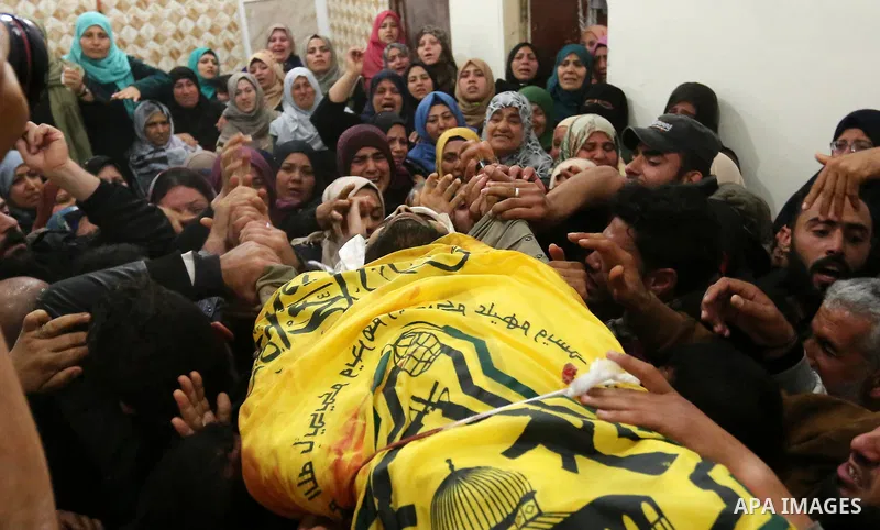 Relatives of Palestinian Hamdan Abu Amshah who was killed a day earlier during clashes with Israeli security forces in a tent city protest along the Israel border with Gaza, demanding the right to return to their homelan...