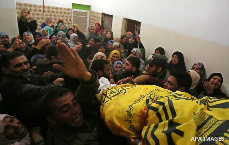 Relatives of Palestinian Hamdan Abu Amshah who was killed a day earlier during clashes with Israeli security forces in a tent city protest along the Israel border with Gaza, demanding the right to return to their homelan...