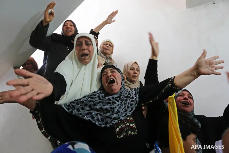 Relatives of Palestinian Hamdan Abu Amshah who was killed a day earlier during clashes with Israeli security forces in a tent city protest along the Israel border with Gaza, demanding the right to return to their homelan...