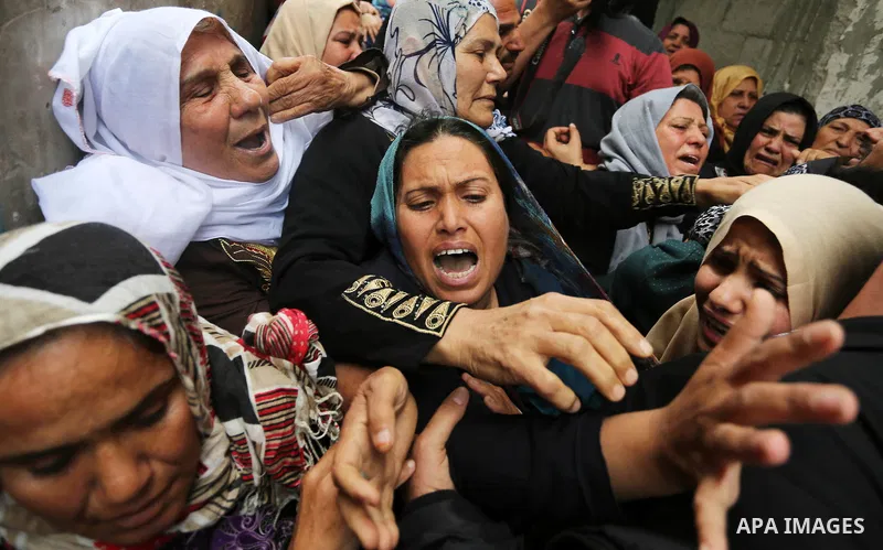 Relatives of Palestinian Hamdan Abu Amshah who was killed a day earlier during clashes with Israeli security forces in a tent city protest along the Israel border with Gaza, demanding the right to return to their homelan...