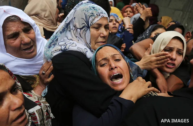 Relatives of Palestinian Hamdan Abu Amshah who was killed a day earlier during clashes with Israeli security forces in a tent city protest along the Israel border with Gaza, demanding the right to return to their homelan...