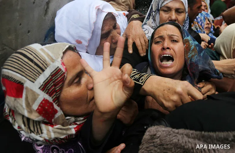Relatives of Palestinian Hamdan Abu Amshah who was killed a day earlier during clashes with Israeli security forces in a tent city protest along the Israel border with Gaza, demanding the right to return to their homelan...