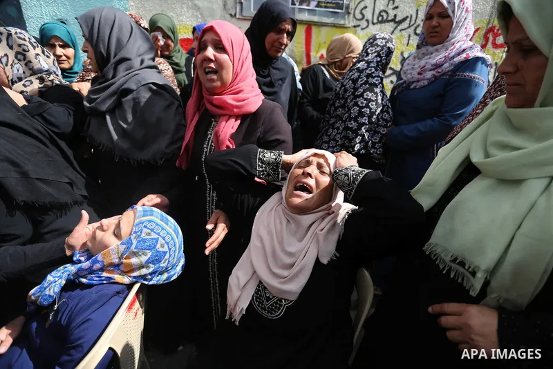 Relatives of Palestinian Hamdan Abu Amshah who was killed a day earlier during clashes with Israeli security forces in a tent city protest along the Israel border with Gaza, demanding the right to return to their homelan...