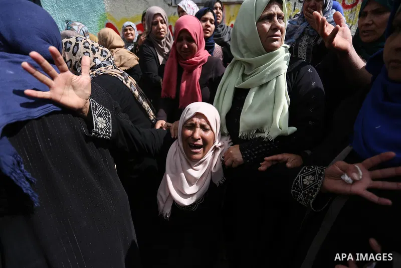 Relatives of Palestinian Hamdan Abu Amshah who was killed a day earlier during clashes with Israeli security forces in a tent city protest along the Israel border with Gaza, demanding the right to return to their homelan...