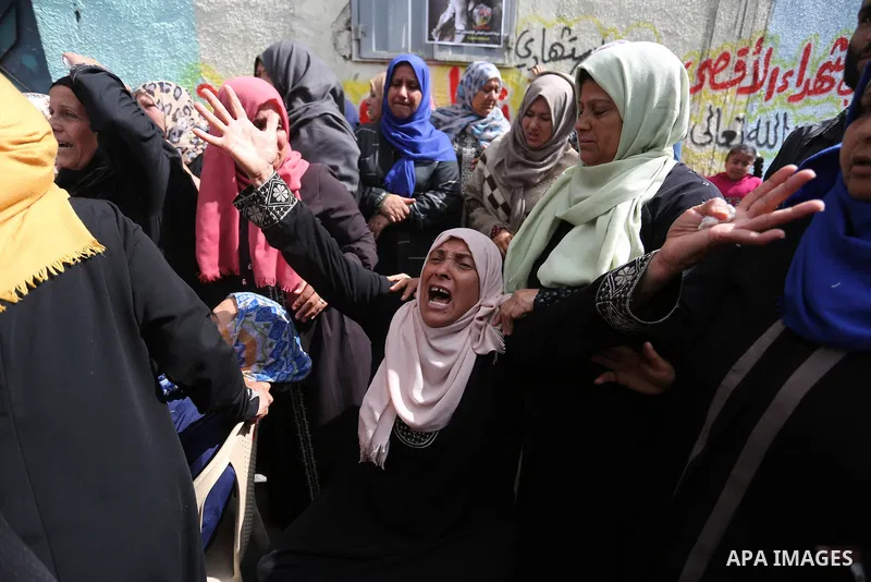 Relatives of Palestinian Hamdan Abu Amshah who was killed a day earlier during clashes with Israeli security forces in a tent city protest along the Israel border with Gaza, demanding the right to return to their homelan...