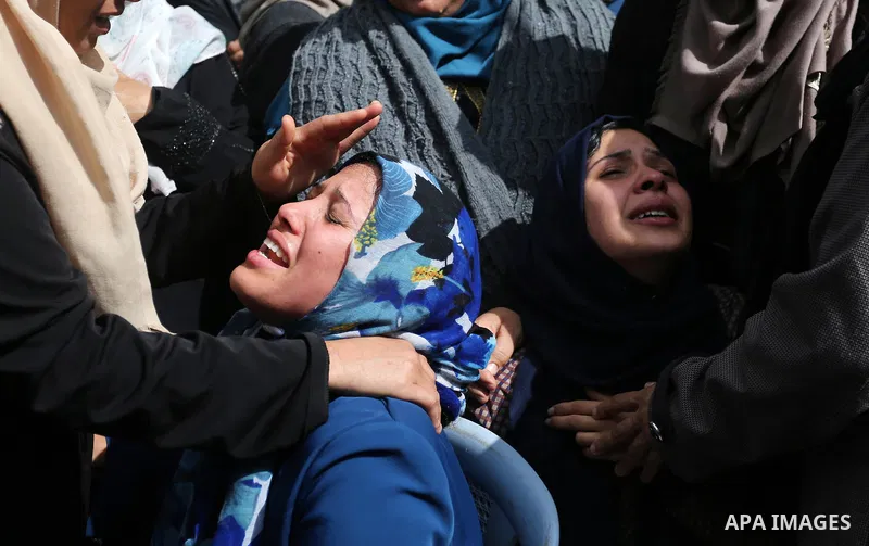 Relatives of Palestinian Hamdan Abu Amshah who was killed a day earlier during clashes with Israeli security forces in a tent city protest along the Israel border with Gaza, demanding the right to return to their homelan...