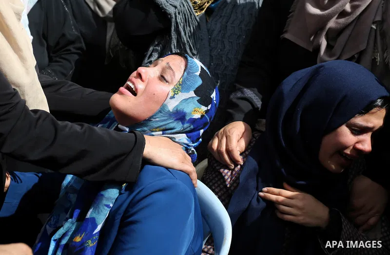 Relatives of Palestinian Hamdan Abu Amshah who was killed a day earlier during clashes with Israeli security forces in a tent city protest along the Israel border with Gaza, demanding the right to return to their homelan...