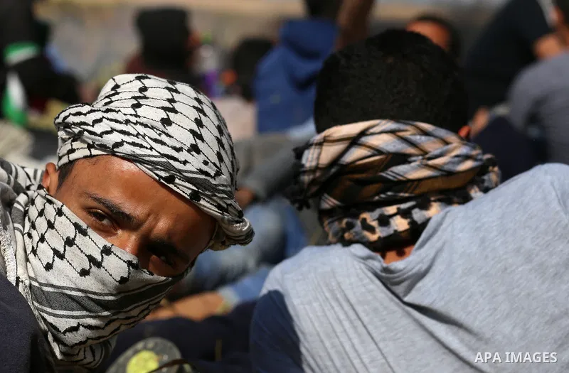 Palestinian protesters clash with Israeli security forces during a demonstration near the border with Israel, east of Khan Yunis, in the southern Gaza Strip on March 31, 2018. The UN Security Council heard fears of a fur...