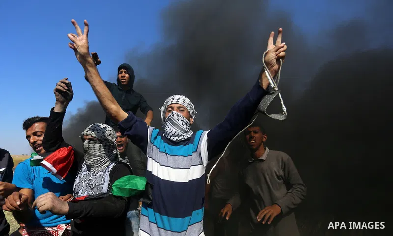 Palestinian protesters clash with Israeli security forces during a demonstration near the border with Israel, east of Khan Yunis, in the southern Gaza Strip on March 31, 2018. The UN Security Council heard fears of a fur...