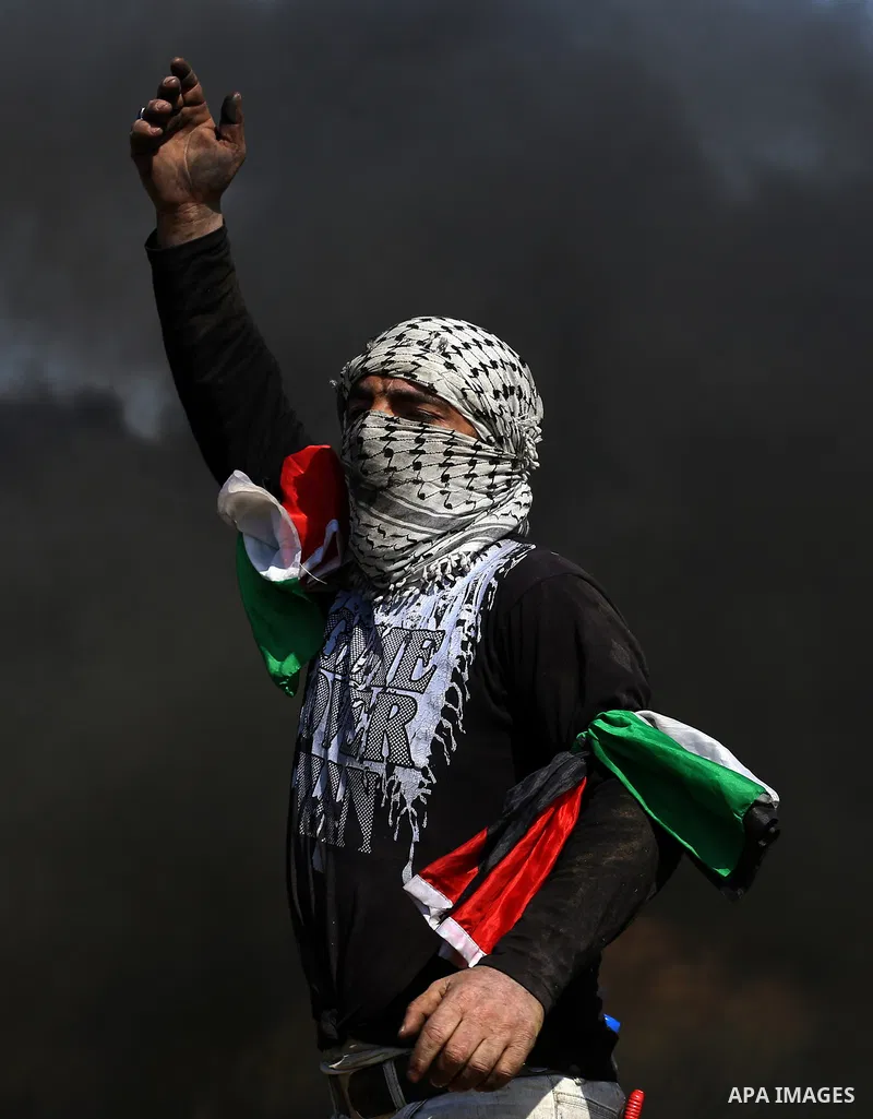 Palestinian protesters clash with Israeli security forces during a demonstration near the border with Israel, east of Khan Yunis, in the southern Gaza Strip on March 31, 2018. The UN Security Council heard fears of a fur...