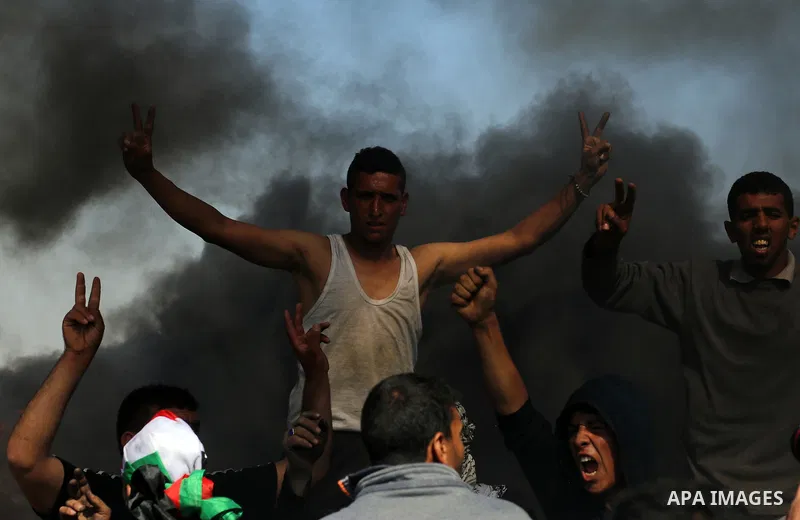 Palestinian protesters clash with Israeli security forces during a demonstration near the border with Israel, east of Khan Yunis, in the southern Gaza Strip on March 31, 2018. The UN Security Council heard fears of a fur...