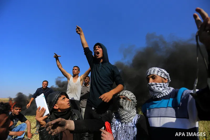Palestinian protesters clash with Israeli security forces during a demonstration near the border with Israel, east of Khan Yunis, in the southern Gaza Strip on March 31, 2018. The UN Security Council heard fears of a fur...