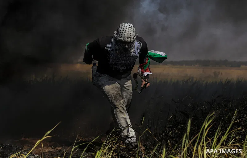 Palestinian protesters clash with Israeli security forces during a demonstration near the border with Israel, east of Khan Yunis, in the southern Gaza Strip on March 31, 2018. The UN Security Council heard fears of a fur...