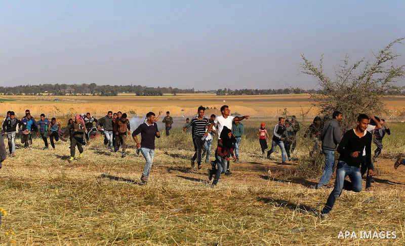 Palestinian protesters clash with Israeli security forces during a demonstration near the border with Israel, east of Khan Yunis, in the southern Gaza Strip on March 31, 2018. The UN Security Council heard fears of a fur...