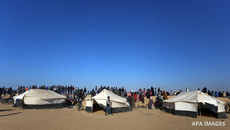 Palestinians take part during a tent city protest along the border with Israel, east of Khan Yunis, in the southern Gaza Strip on March 31, 2018. The UN Security Council heard fears of a further escalation in Israeli-Pal...
