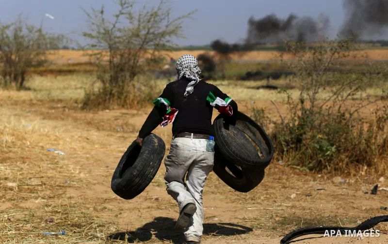 Palestinian protesters clash with Israeli security forces during a demonstration near the border with Israel, east of Khan Yunis, in the southern Gaza Strip on March 31, 2018. The UN Security Council heard fears of a fur...