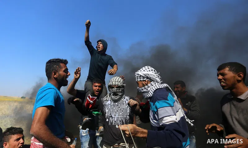 Palestinian protesters clash with Israeli security forces during a demonstration near the border with Israel, east of Khan Yunis, in the southern Gaza Strip on March 31, 2018. The UN Security Council heard fears of a fur...
