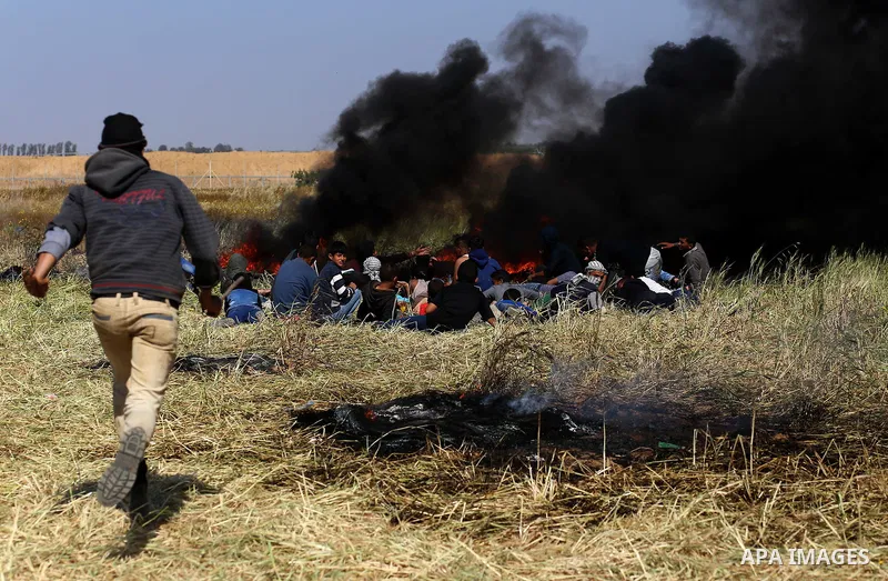 Palestinian protesters clash with Israeli security forces during a demonstration near the border with Israel, east of Khan Yunis, in the southern Gaza Strip on March 31, 2018. The UN Security Council heard fears of a fur...